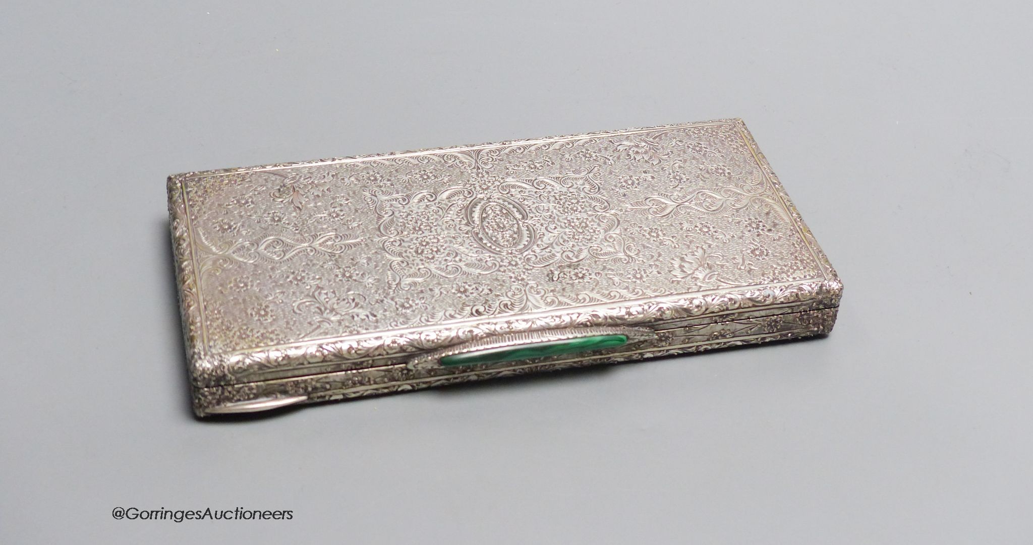 An Italian 800 standard foliate engraved cigarette case, malachite thumb rest, Retailers label C. Pavese, Genova, 10.8oz., 18 cm